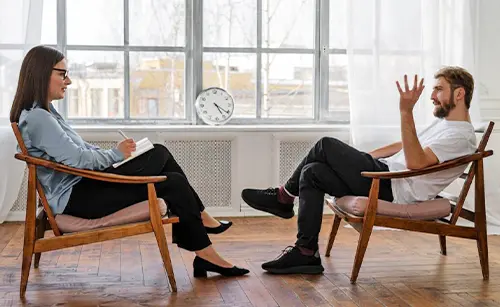 Man Speaking to Therapist